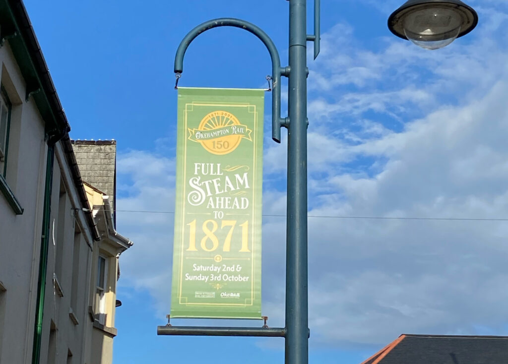 Street banner celebrating Okehampton 150th railway celebrations